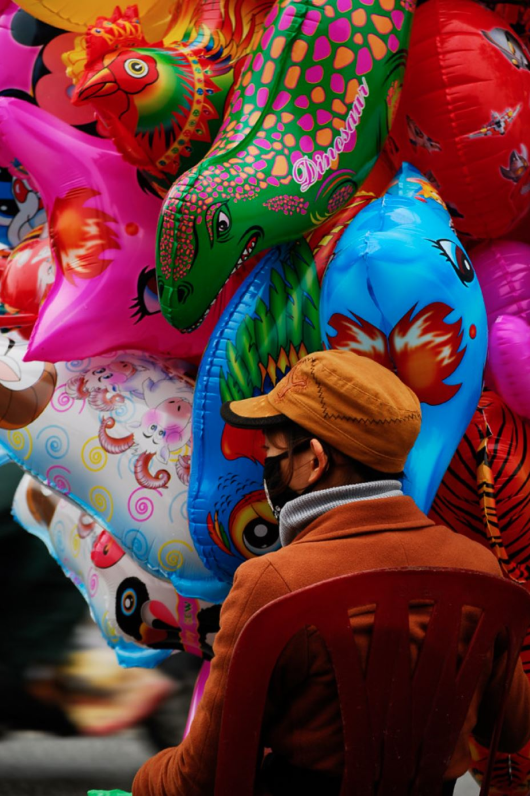 A woman selling balloons in Hanoi, Vietnam